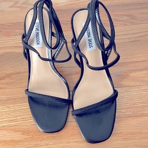 Steve Madden black strappy heels.